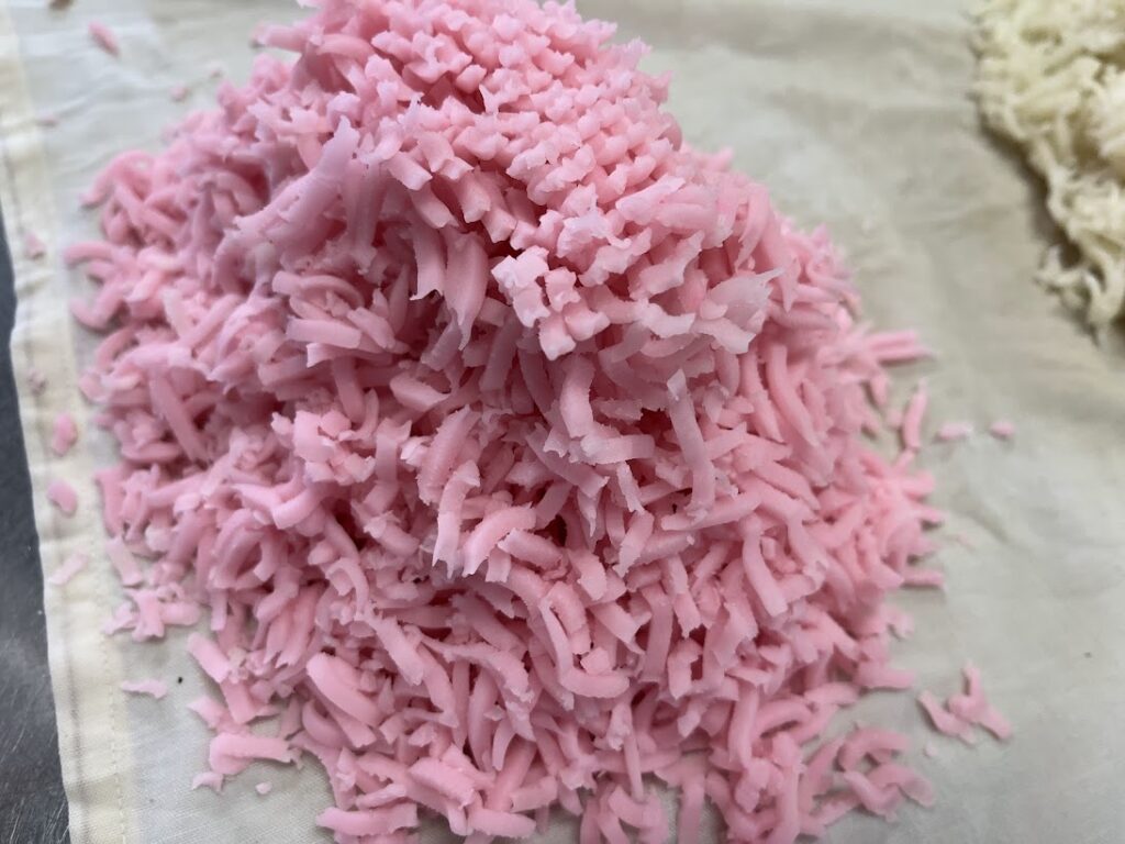 きんとんぶるいでこしだした此の花の赤